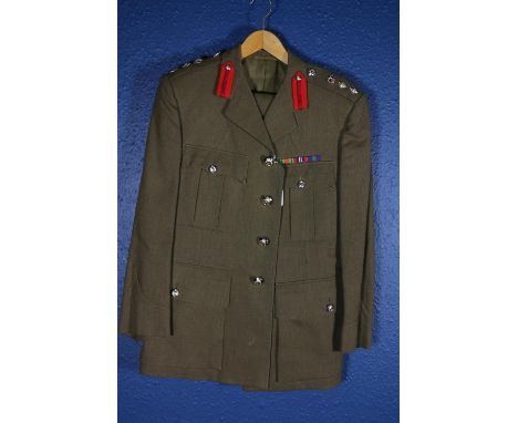 British Army uniform, a khaki green jacket with pocket label for Moss Bros of Covent Garden, epaulettes for the rank of Colon