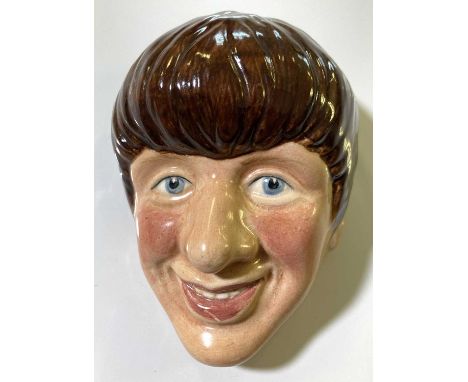 An original hand-painted ceramic wall plaque depicting a profile of Ringo Starr. Measures approx 12cm tall. C 1960s.