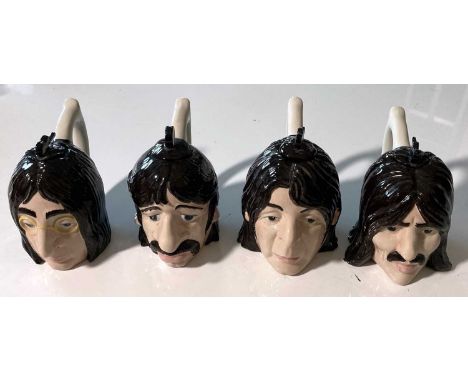 A set of four Lorna Bailey ceramic teapots, each approx 15cm tall and in good condition.
