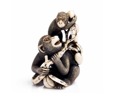 JAPANESE IVORY NETSUKE OF A PAIR OF MONKEYS IN A PEACH TREE BRANCH
after Okatomo, Kyoto, early 19th century, adult monkey at 