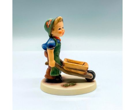 Hand painted figure of a young boy pushing a wagon. Goebel backstamp. Artist: M.I. HummelIssued: 2002Dimensions: 3.5"L x 2.5"