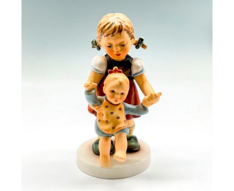 Hand painted little girl assisting baby to walk colored in blue, brown and cream. Goebel backstamp. Hummel impressed mark. 21