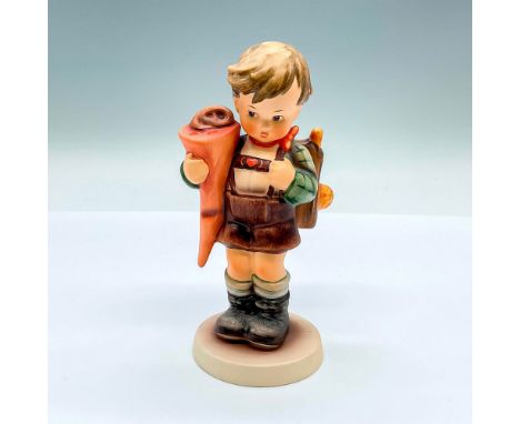 Hand painted figure of a young boy with a backpack. Goebel backstamp. Artist: M.I. HummelIssued: 1993Dimensions: 2.75"L x 2.7