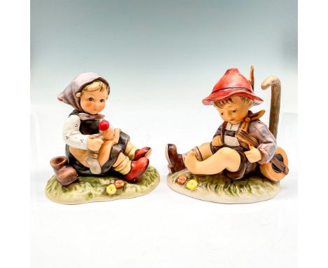 Includes hand painted figural seated missing a shoe, carrying his instrument (470 Time Out) and seated girl holding sock with