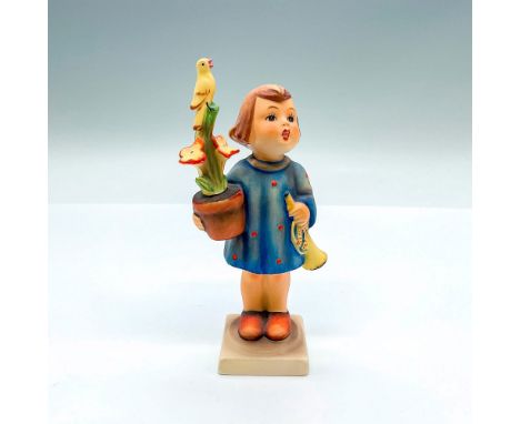 Hand painted figure of a young girl holding a potted plant and a trumpet. Goebel backstamp. Artist: M.I. HummelIssued: 20th c