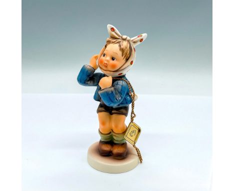 HUM 217; 50th anniversary hand painted figure of a young boy attempting to soothing his aching mouth. Goebel backstamp. Artis