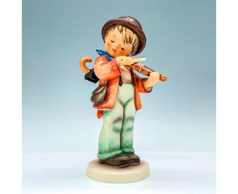 Hummel porcelain figure showcasing a charming character often seen wearing a brown derby with an orange band, delighting ever