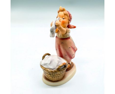 Hand painted girl with pink apron and basket of laundry. Goebel backstamp. Issued: 2000Dimensions: 3.75"L x 2.5"W x 5.75"HMan