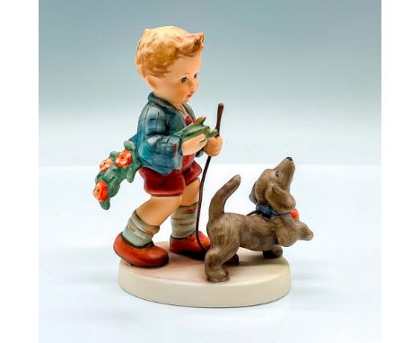 Limited edition hand painted figure of a young boy walking his spaniel dog. Goebel backstamp. Artist: M.I. HummelIssued: 2007