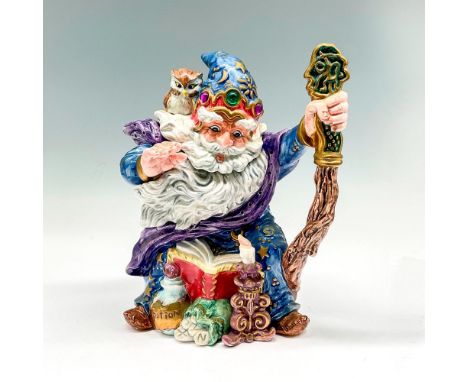 This creative, colorful teapot is part of a Collector's Series. Intricate design colored in blue, lavender, brown and gold to