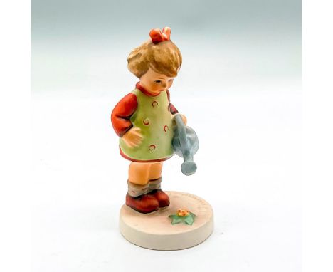Hand painted girl with blue watering can. Goebel backstamp. Issued: 1981Dimensions: 4.5"H x 2" dia.Manufacturer: Goebel Humme