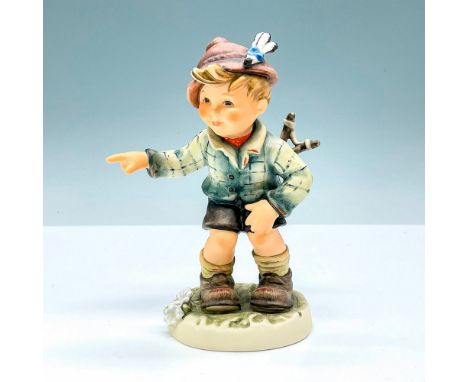Hummel porcelain figure featuring mischievous boy with slingshot in back pocket pointing a finger. Goebel backstamp TMK8. M. 