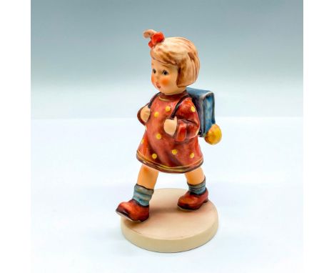 HUM 467; hand painted figure of a young girl with a backpack. Goebel backstamp. Artist: M.I. HummelIssued: 1999Dimensions: 3"