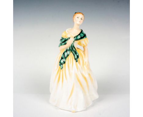 Special edition of 2000, exclusive to Joans Gift Shop. She wears a green plaid scarf and bow over her yellow gown. Royal Doul