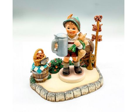 Hand painted boy with green hat, blue stein and bunch of turnips. Includes Marktplatz. base. Hummel backstamp West Germany. I