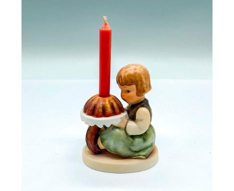 Hand painted figure of a young girl holding a birthday Bundt cake. Red candle included. Goebel backstamp. Artist: M.I. Hummel