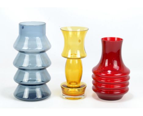 TAMARA ALADIN FOR RIIHIMAKI; an amber glass vase, height 28cm, an Aseda red glass vase with ribbed lower section and a smoky 