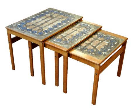 OX ART; a 1970s Danish teak nest of three tables, each set with stoneware tiles, the two larger signed and dated '75, width o