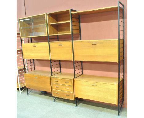 LADDERAX; a teak wall unit comprising four ladders, glazed cabinet, open cabinet, two cocktail cabinets, two record cabinets,