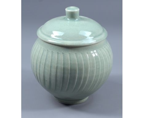 DAVID LEACH (1911-2005) for Lowerdown Pottery; a fluted porcelain jar and cover, green celadon glaze, impressed DL mark, heig