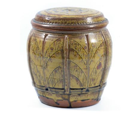 MIKE DODD (born 1943); a stoneware jar and cover, applied and incised decoration covered in green ash glaze, incised MJD mark