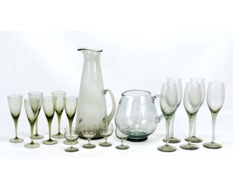 A group of Swedish and Danish glass comprising a set of six Orrefors 'Mirabel' smoked grey wine glasses, a similar set of fou