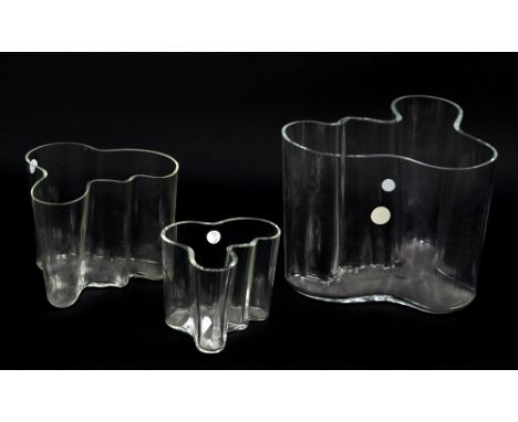 ALVAR AALTO FOR IITTALA; a set of three graduated 'Savoy' clear glass vases, all etched with the designer's name to bases, he