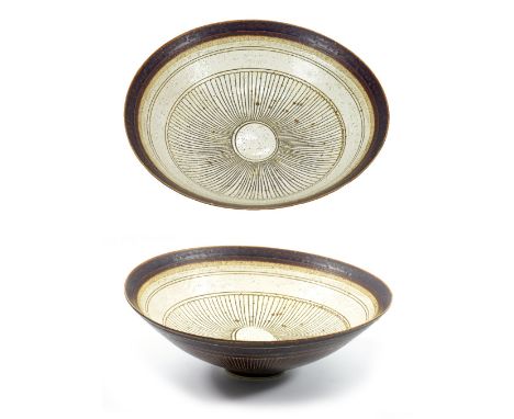 LUCIE RIE (1902-1995); an early sgraffito porcelain bowl, pitted cream glaze to interior and manganese to rim and exterior an