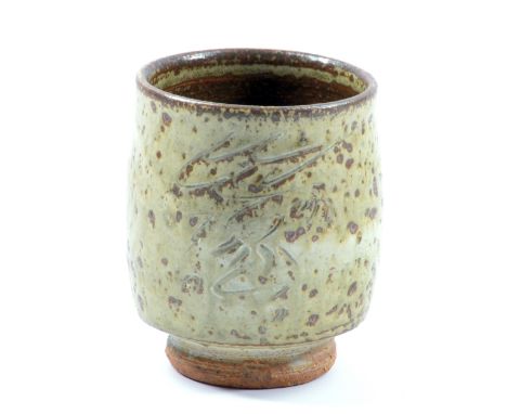 JIM MALONE (born 1946); a stoneware yunomi covered in mottled green ash glaze with incised decoration, impressed JM mark, hei