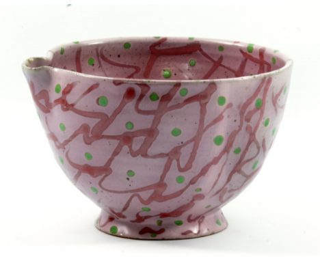JANICE TCHALENKO (1942-2018); a stoneware pouring bowl decorated with a variant of the 'jazz' pattern on a pink ground, diame
