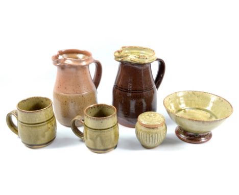 RICHARD BATTERHAM (born 1936); a salt-glazed jug and another stoneware jug covered in tenmoku glaze with green ash rim, a ped