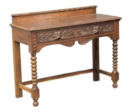 A Victorian carved oak gallery back side table with Man of The Forest handles, raised on Bobbin Turned supports. Circa 1860/1