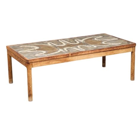 A large Danish Mid Century teak coffee table with tile top by Trioh. 125x64.5x42cm 