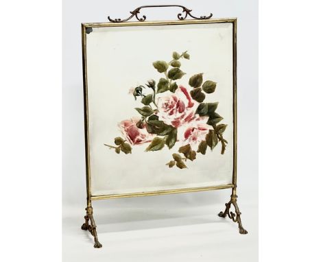 An Edwardian period brass framed firescreen with painted bevelled glass. 47x22x68cm 