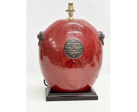 A large Chinese style glazed pottery table lamp. 30x43cm 