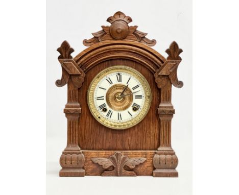 A Late 19th Century American oak cased mantle clock by Ansonia Clock Co. Eight Day Trieste Strike. With key and pendulum. 29x