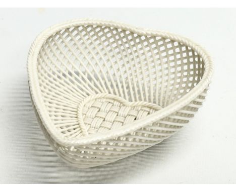 A small Belleek Pottery woven bowl. 10x11.5x4.5cm. 