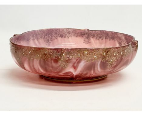 Loetz Carneol. A large Late 19th Century Bohemian glass bowl, with hand painted embossed gilding and raised on a round flat b