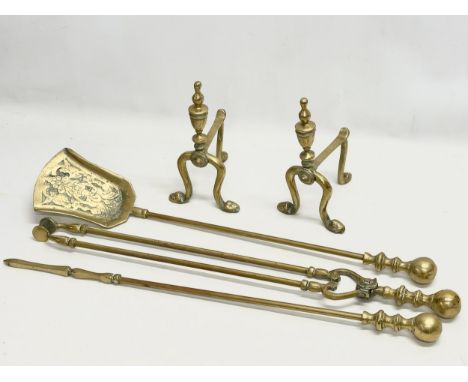 A pair of vintage brass andirons and fire tools 