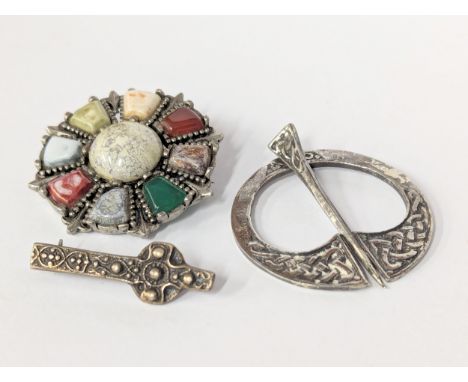 A quantity of Celtic silver brooches. 