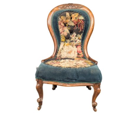 A Victorian walnut ladies chair with original tapestry seat and back on Cabriole legs. 