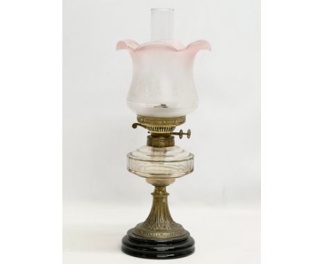 A Late 19th Century Victorian double burner oil lamp. With later shade. 54cm 