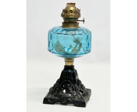 A Late 19th Century Victorian oil lamp with blue glass bowl. 29cm 