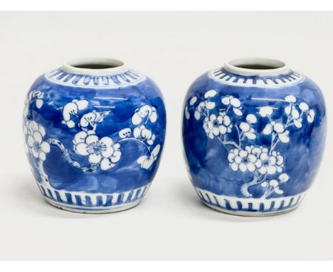 A pair of 19th Century Chinese prunus pattern jars. Kangxi 4 character. 10x11cm. 