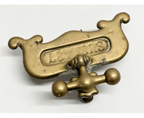A Victorian brass letter box/door knocker. 23x14cm. 