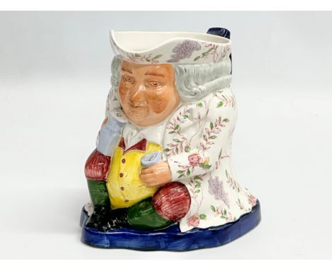 A Late 19th/Early 20th Century Copeland Spode ‘Wisteria’ toby jug. Red stamp. 18x15x17cm. 