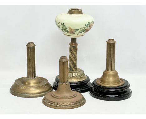 A collection on Victorian brass oil lamp bases. 37cm 