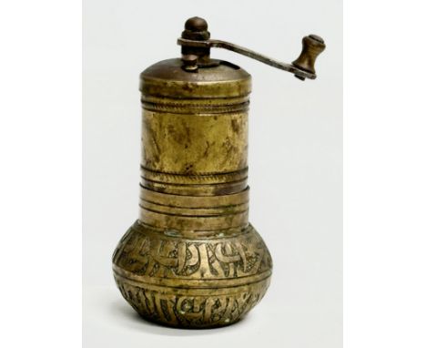 A Late 19th Century brass spice grinder. 11cm. 