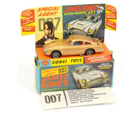 Corgi Toys 261 "James Bond" Aston Martin "Goldfinger" - Gold body, red interior, with "James Bond" and bandit figures, silver