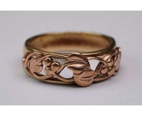 9ct rose and yellow gold dress ring, openwork sinuous form depicting vine leaves and berries, band width approx 8.3mm, ring s